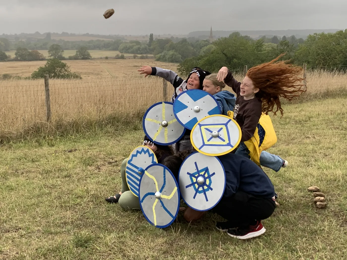 Children with painted shields during the Anglo-Saxons meet the Vikings day at The Chellington Centre