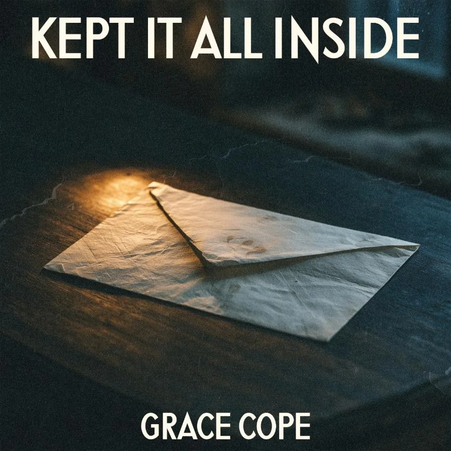 Single cover for Kept It All Inside by Grace Cope: a creased envelope lying on a dark wooden table in a pool of lamplight