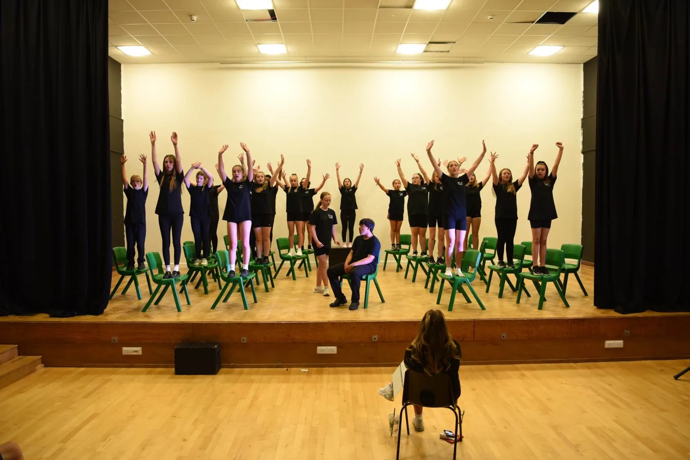 Students rehearsing on stage at Kempston Academy