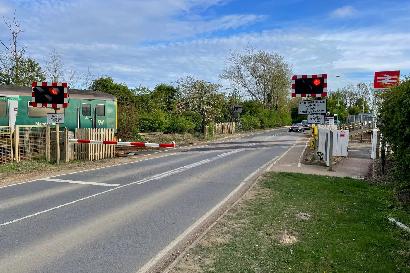 The Manor Road level crossing at Kempston Hardwick station, photographed in April 2025 before the closure. The station stays open, reached from the Woburn Road end only.